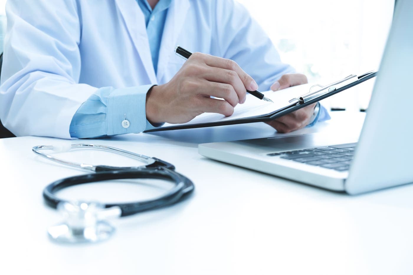 Medical billing specialist managing claim records and reimbursement paperwork